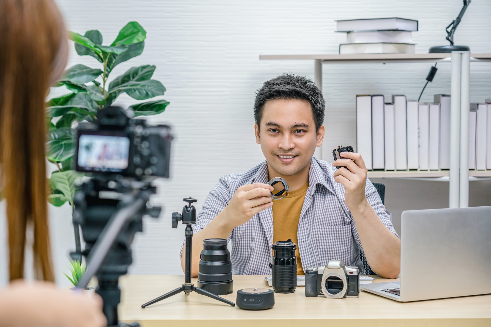 asian vlogger man satisfied the camera lens each media video cameraman taking video