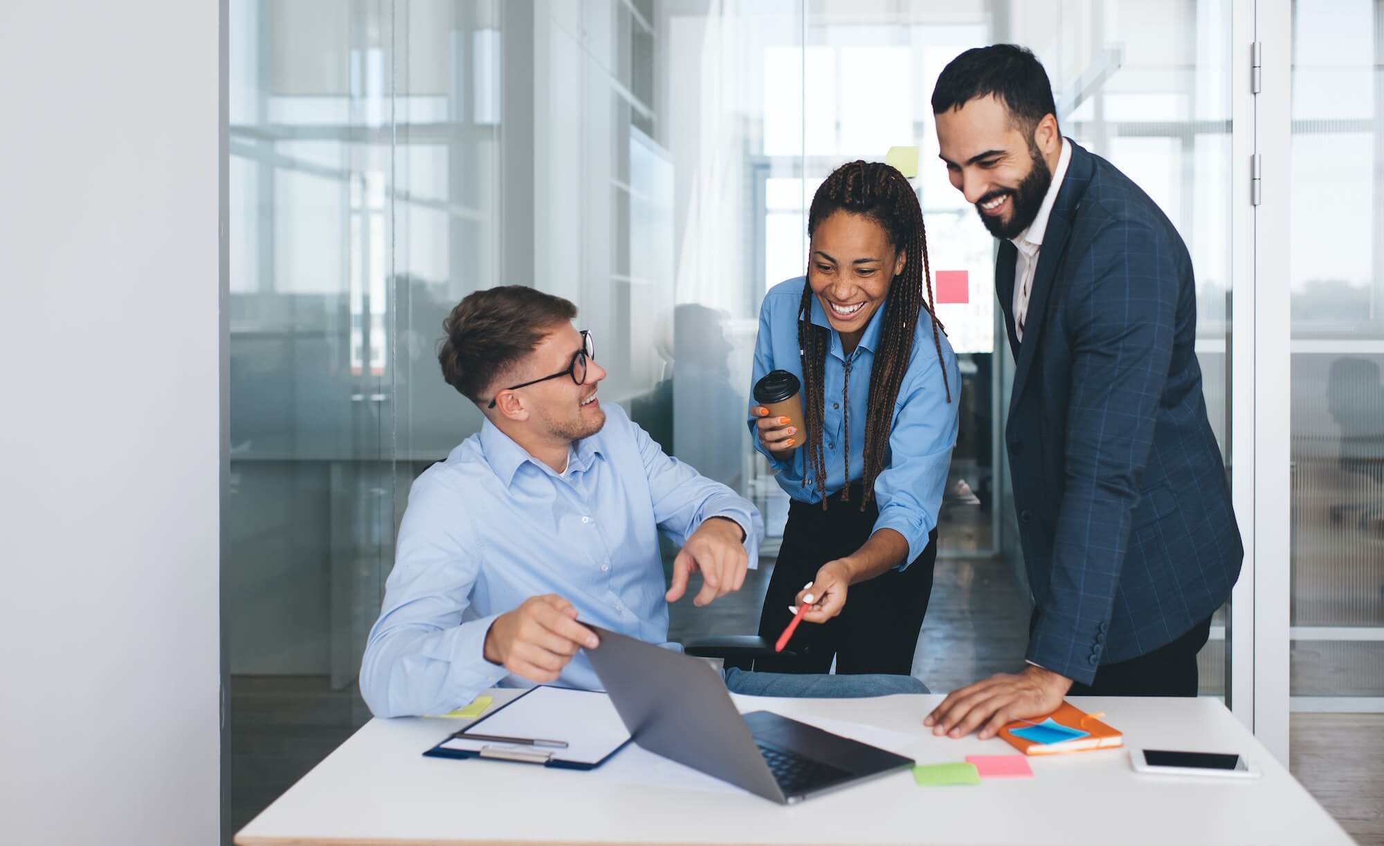 group of happy managers discussing marketing plan and smiling in office1